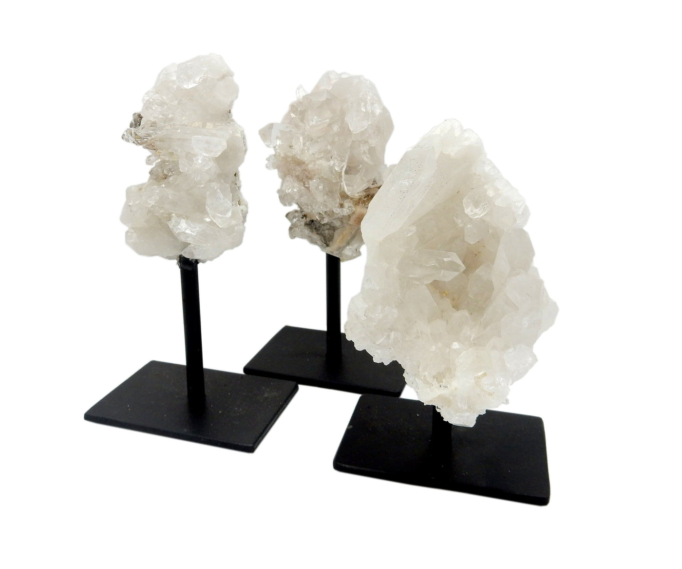 Three Crystal Quartz Cluster on metal stand, displayed on a white surface.