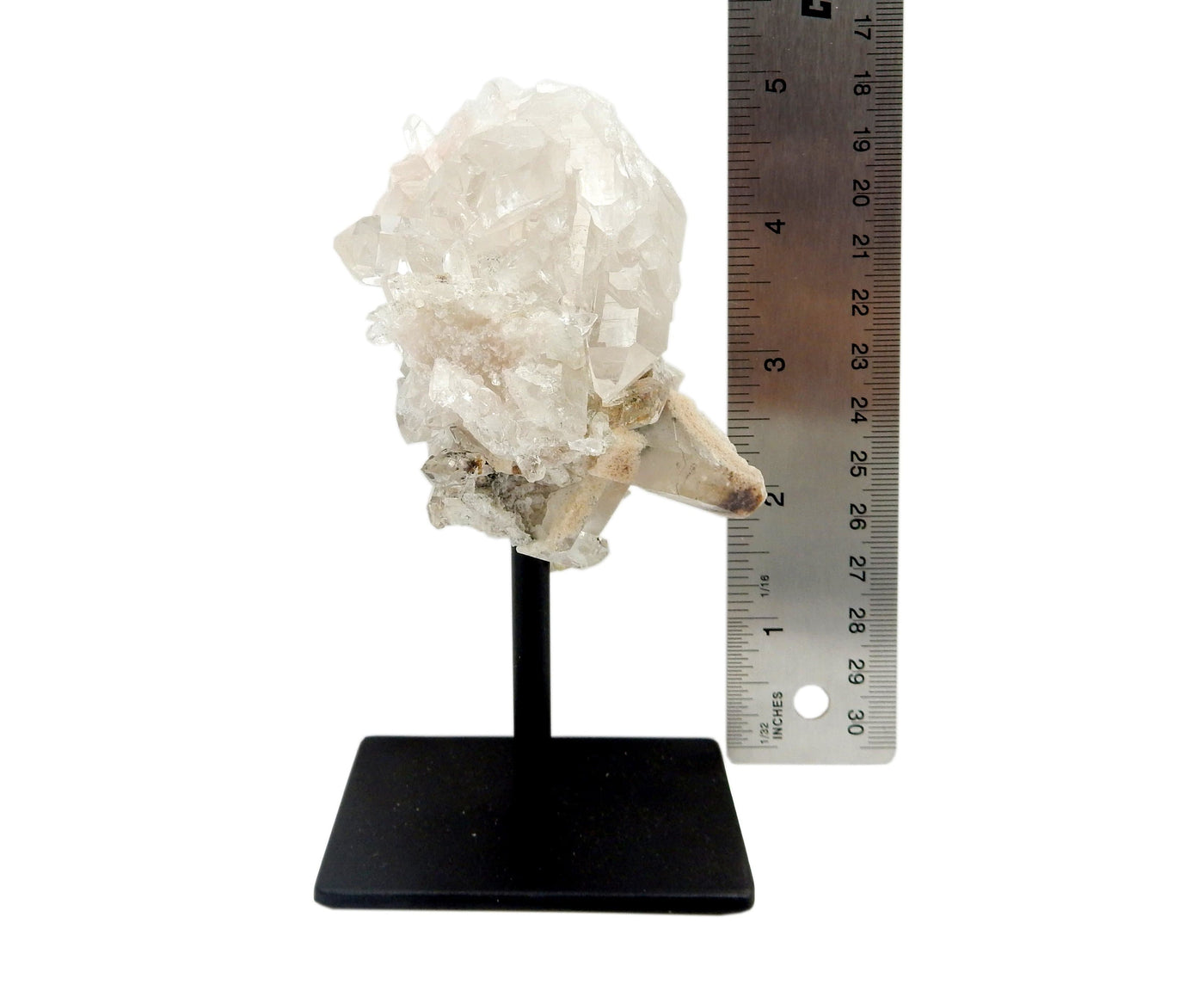 one Crystal Quartz Cluster on Metal Stand displayed next to a ruler for size reference.