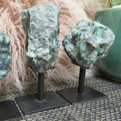 3 different size of Emerald on metal stand line up.