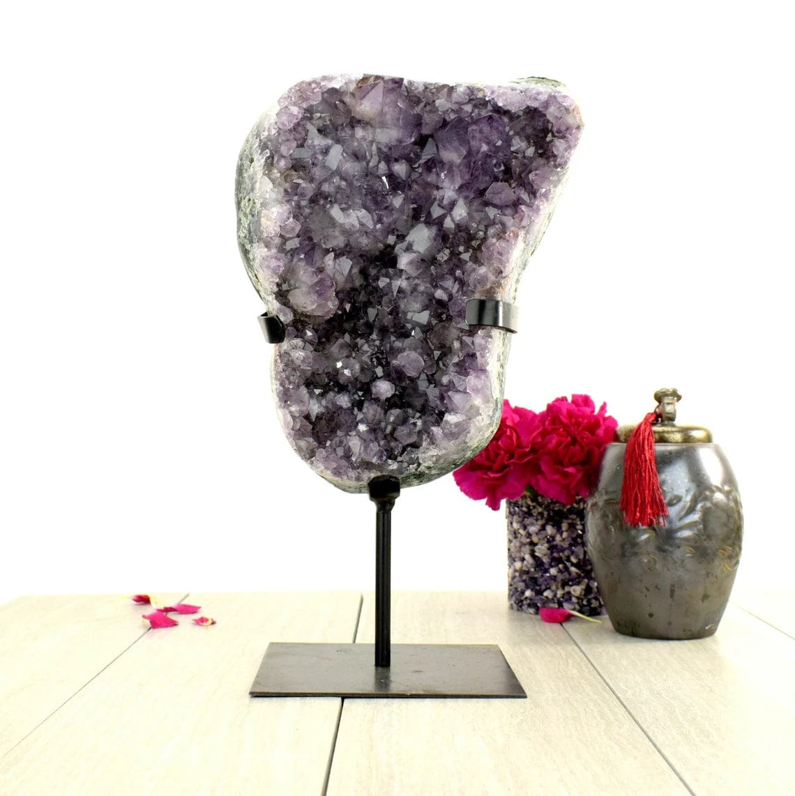 Amethyst Crystal Purple Geode on Metal Stand on display