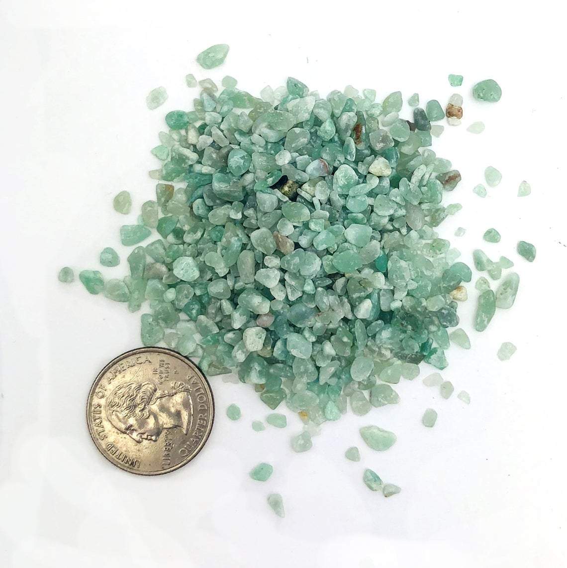 Green Quartz Tiny Chip Stones next to a quarter for size reference