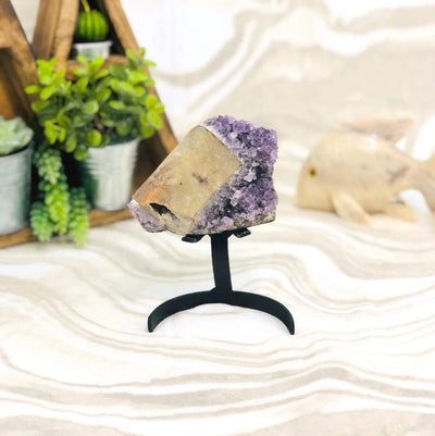 Amethyst Crystal Purple Geode With Calcite on Metal Stand on display