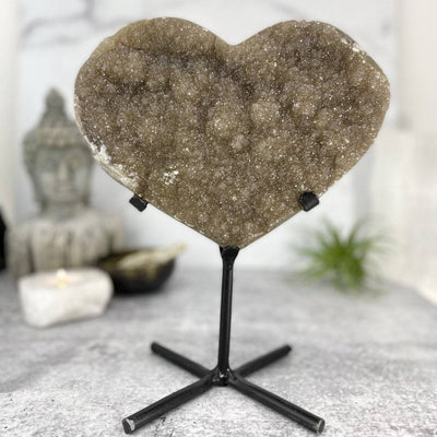 Druzy Heart on Stand with decorations in the background