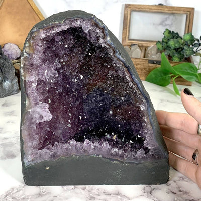 Amethyst Geode Cathedral with decorations in the background