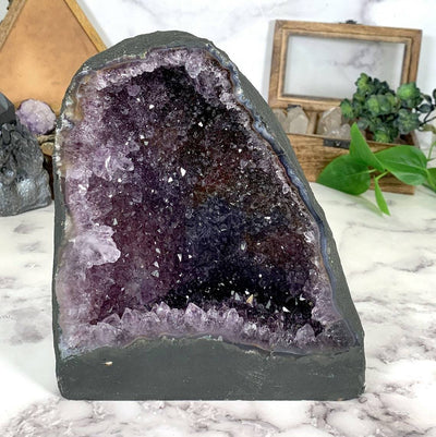 Amethyst Geode Cathedral with decorations in the background