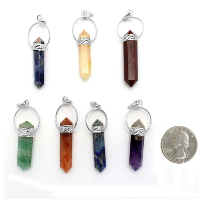 silver seven chakra point pendant set with quarter for size reference