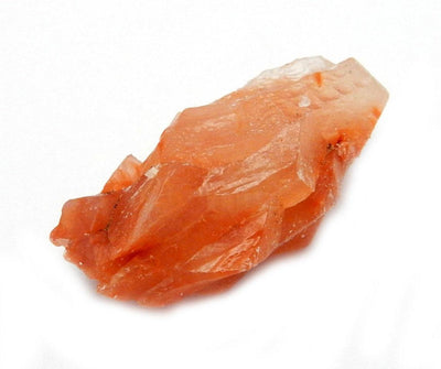 Up close shot of Red Calcite Stone on white background