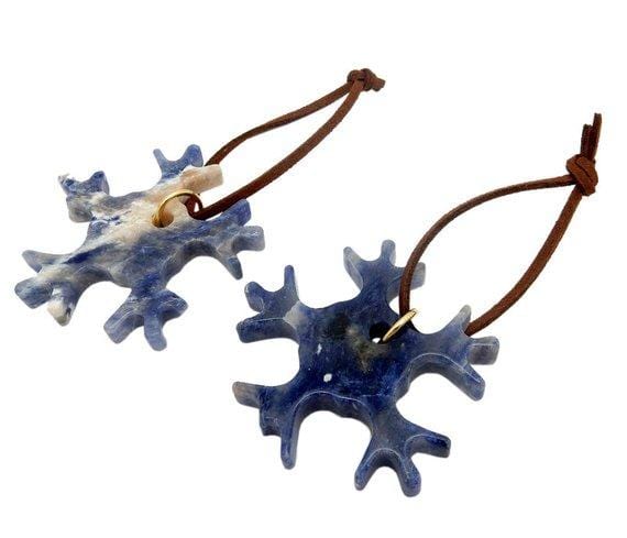 two sodalite snowflake christmas ornaments on white background for possible variations