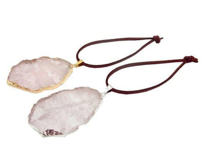 rose quartz ornaments displayed in silver and gold with brown faux leather tie side view for thickness reference