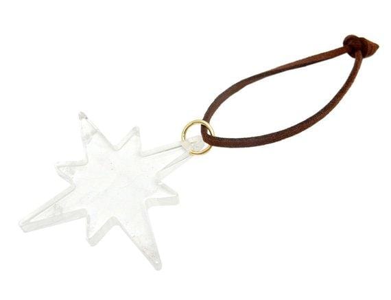 Picture of Crystal quartz agate star, displayed on a white back ground.