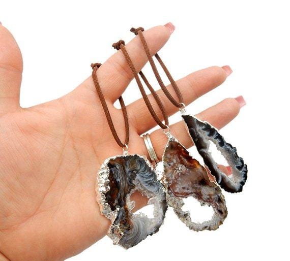 Freeform Silver Trim Agate Christmas Ornaments in hand to show size reference