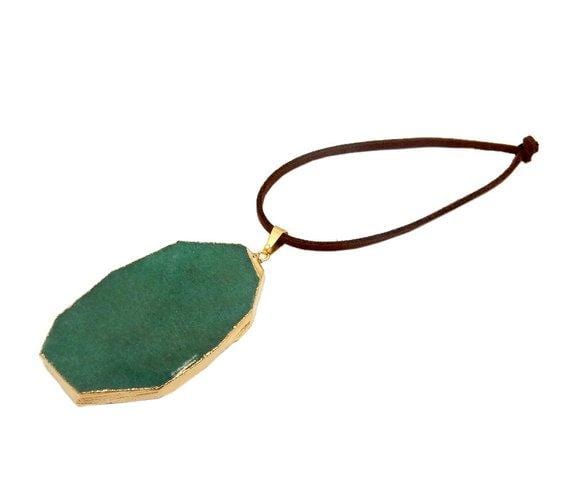 green aventurine ornaments displayed in gold with brown faux leather tie side view for thickness reference
