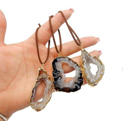 Freeform Gold Trim Agate Christmas Ornaments in a hand for size reference