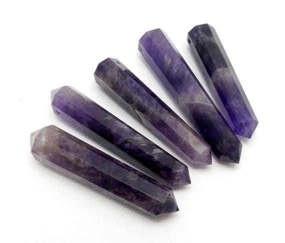 amethyst points fanned out on a table