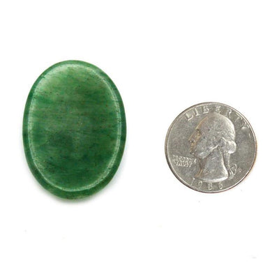 Single Worry Stone next to quarter for size comparison 