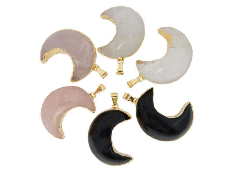 Crystal Quartz, rose quartz and black onyx moons with a gold edges, laid out in a circle