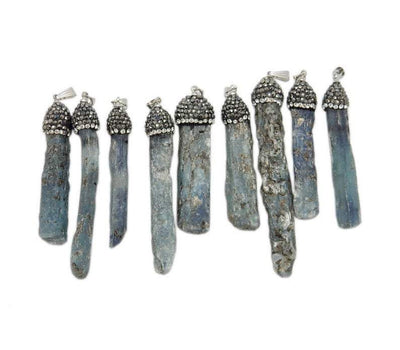 multiple kyanite pendants displayed to show the differences in the color shades and sizes. available in silver 