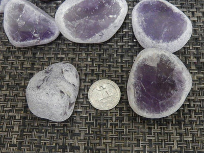 tumbled amethyst seer stones with quarter for size reference