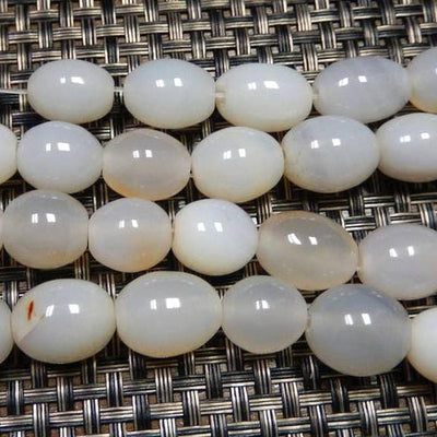 White Agate Egg Shaped Beads showing color variations