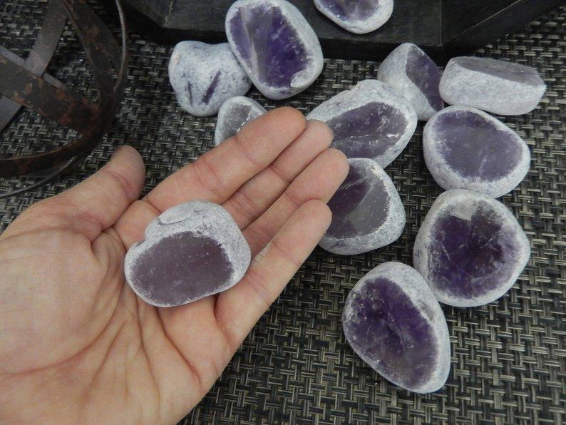 tumbled amethyst seer stone in hand for size reference 