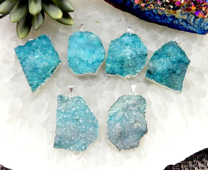 6 teal druzy pendants freeform shapes with silver plating around them and silver plated bail.