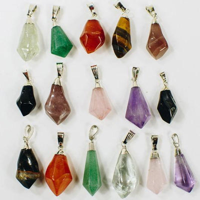 Gemstone Point Pendants with Electroplated Silver Cap and Bail on a white background