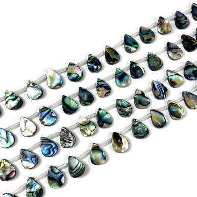 Multiple Abalone Drop Beads on strands displayed.