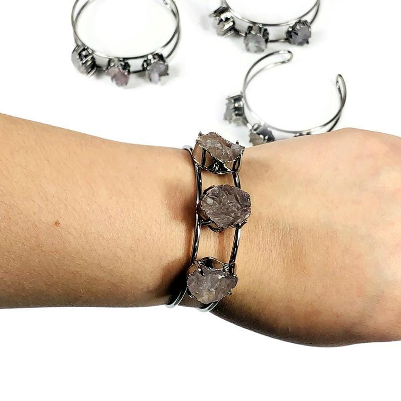 Gun metal plated druzy cuf on a woman's wrist.