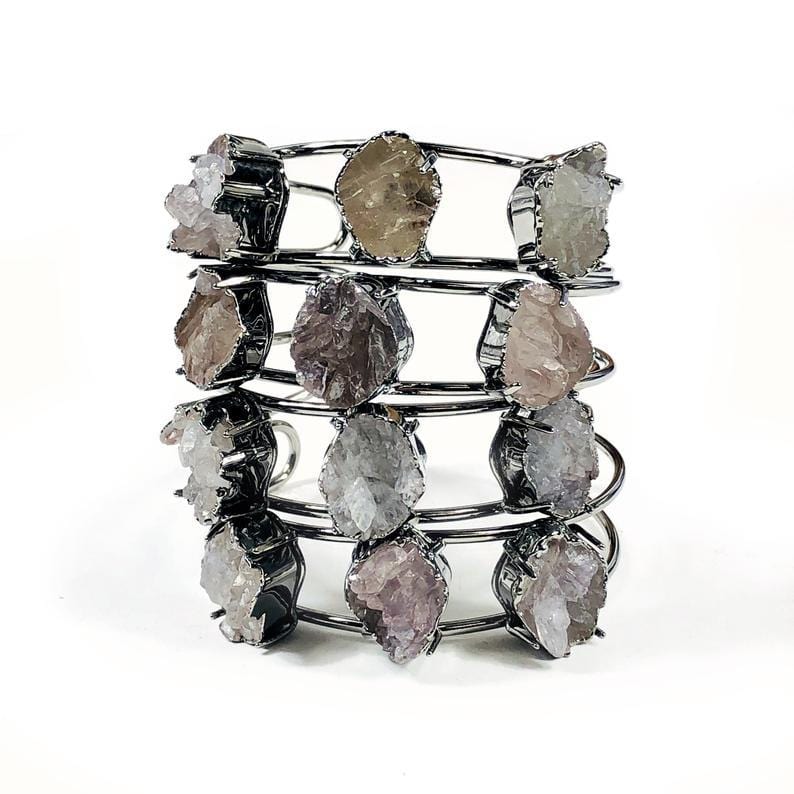 Assorted gun metal plated druzy bracelets on a white background.