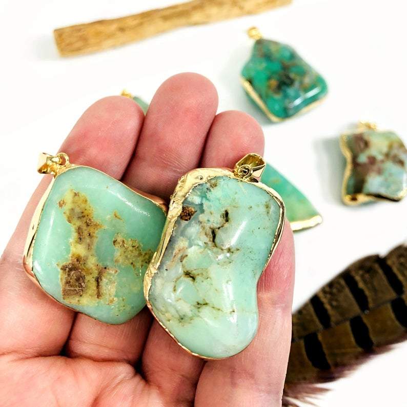 Hand holding Chrysoprase pendants in Electroplated 24k Gold Edge and Bail for a close up