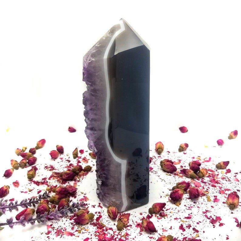 Amethyst Crystal Cut Base, side view with decorations in the background