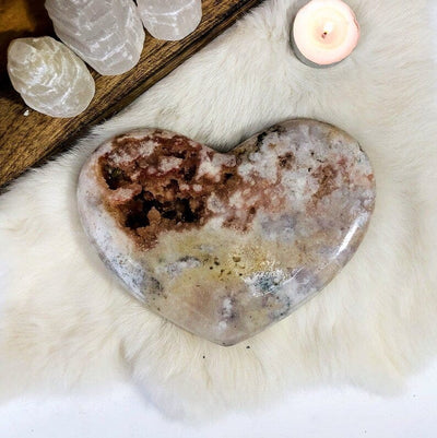 Pink Amethyst Polished Heart on a fuzzy background showing its beautiful druzy