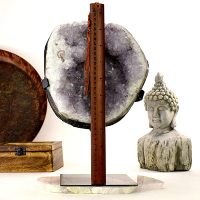 Amethyst Crystal Purple Geode on Metal Stand with a ruler for size reference
