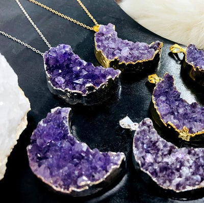 Amethyst Druzy Moon Pendants with Electroplated 24k Gold/Silver Edges with 2 on a chain, showing from an agle