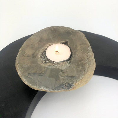 Titanium Geode Candle Holder with Druzy shown with a candle in it