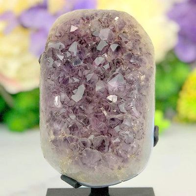 Amethyst Crystal Purple Geode on Metal Stand up close