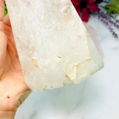 This Crystal Quartz Polished Tower has a crack at the bottom of the tower as shown in this picture