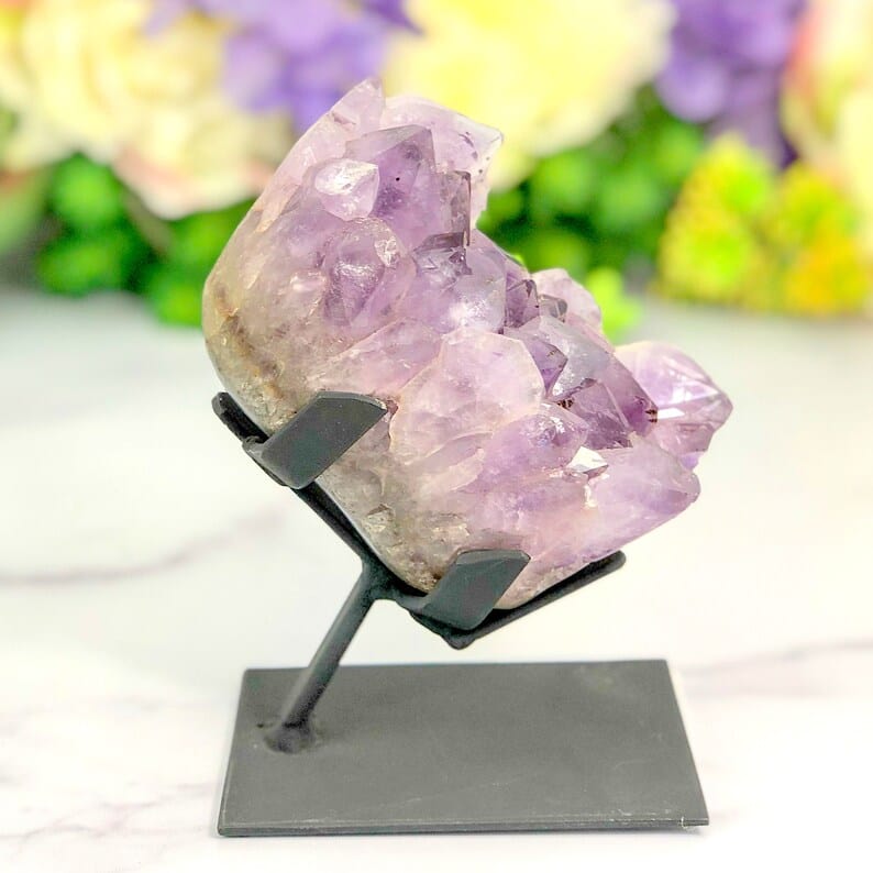 Amethyst Crystal Purple Geode on Metal Stand shot from the side