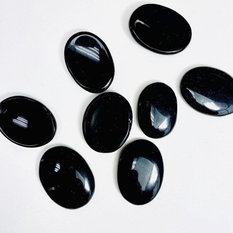 Black Obsidian Worry Stones laid out on a table