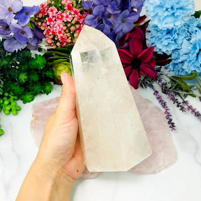 Crystal Quartz Polished Tower in a hand for size reference