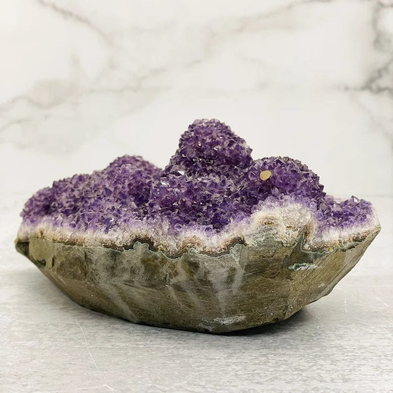 Large amethyst cluster formation with basalt bottom.  This piece is purple clusters on top and gray with green on bottom basalt layer.