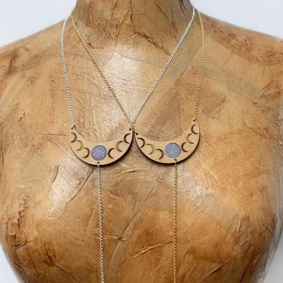up close shot of 2 Druzy On Crescent Moon Phase On Chain Necklaces on mannequin