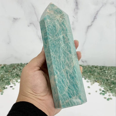 Polished Amazonite Tower in hand for size comparison