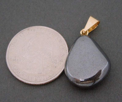 Natural Hematite Pendant - next to a quarter