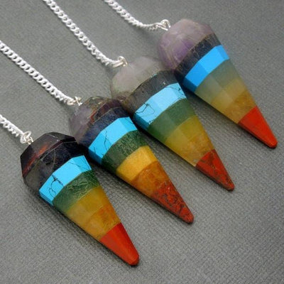 four seven chakra point pendulums on display for possible variations