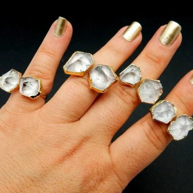 Double Crystal Quartz Point Ring with Electroplated 24k Gold Edges on an adjustable band on fingers for size reference