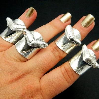Black Shark Tooth Ring with Electroplated Silver Adjustable Hammered Bands on a hand for size reference
