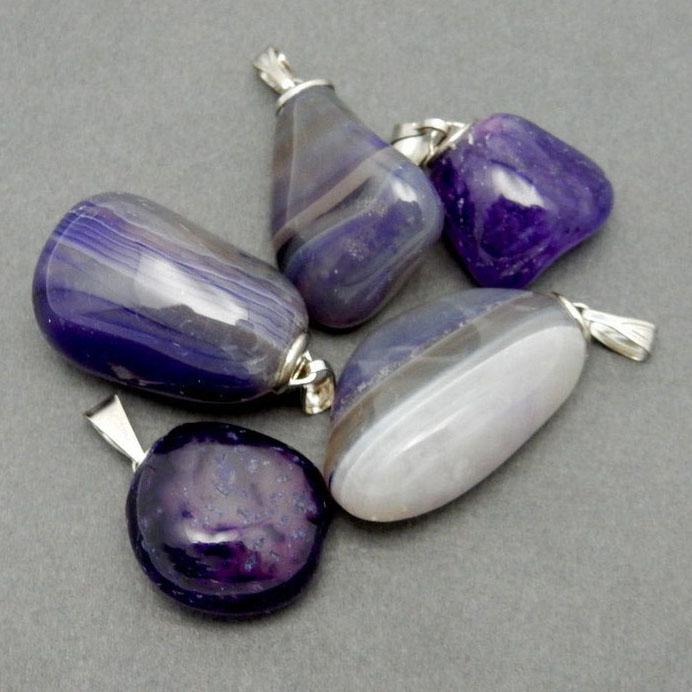 side view of purple agate pendants for thickness reference