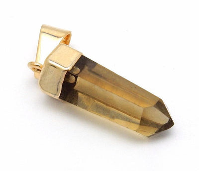 close up of smokey quartz point pendant with gold cap for details