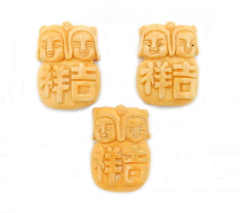 3 Chinese Carved Bone Top to Bottom Drilled Beads on white background